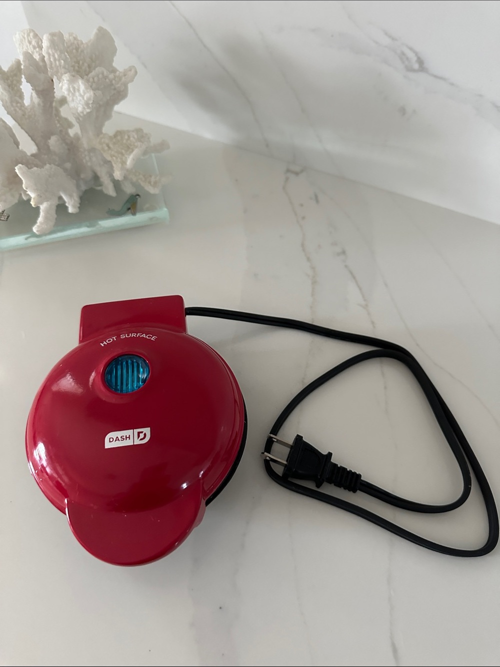 Dash Mini Red Waffle Maker. Makes a heart shape.